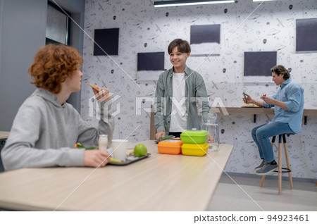 School boys having lunch at school canteen 94923461