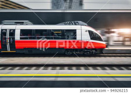 High speed train in motion on the railway station at sunset 94926215