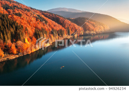 Aerial view of people on boats on blue lake in mountains 94926234
