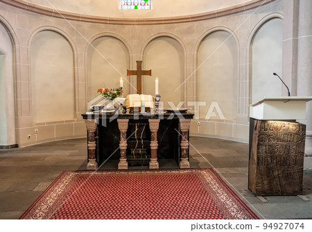 Festive interior decoration with burning candles in temple Church Christianity The ceremony of infant baptism Baptismal Festive interior decoration with burning candles in temple Church Christianity The ceremony of infant baptism Baptismal 94927074