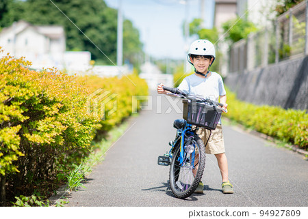 Boy riding his own train in the park 94927809