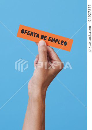the text job offer in spanish in a sign 94927875