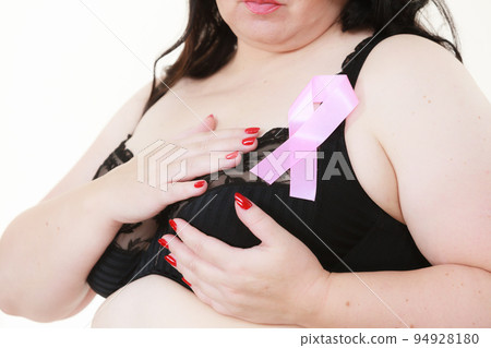 Woman chest in bra, pink cancer ribbon Woman chest in bra, pink cancer ribbon 94928180