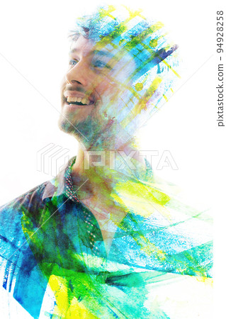 artistic double exposure portrait of a man combined with watercolor brushstrokes 94928258