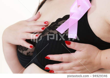 Woman chest in bra, pink cancer ribbon 94929346
