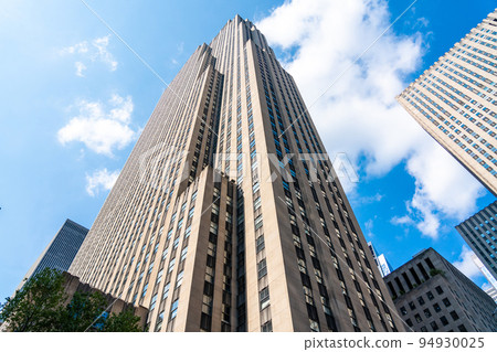 Tower of Rockefeller Center against the blue sky in Manhattan in New York 94930025