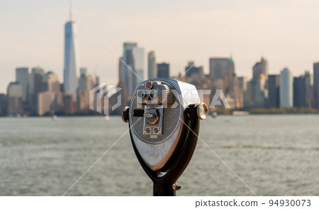 Tourist binoculars on Liberty Island overlooking downtown Manhattan, New York, USA 94930073