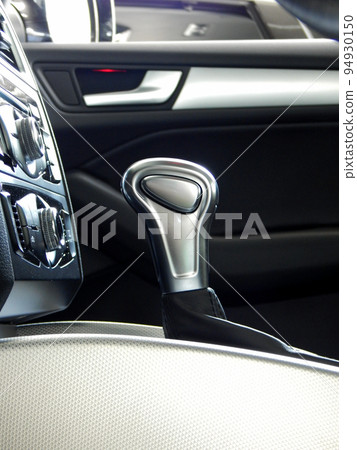 Side view of gear shift knob of automatic transmission inside a car Side view of gear shift knob of automatic transmission inside a car 94930150