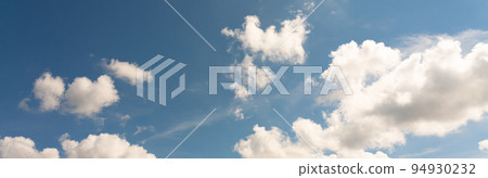 Panoramic background of bright beautiful sky with clouds for design Panoramic background of bright beautiful sky with clouds for design 94930232