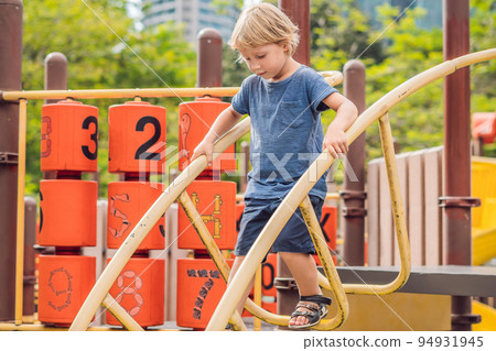 Funny cute happy baby playing on the playground. The emotion of happiness, fun, joy 94931945
