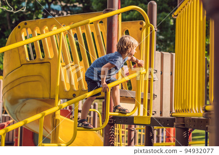 Funny cute happy baby playing on the playground. The emotion of happiness, fun, joy 94932077