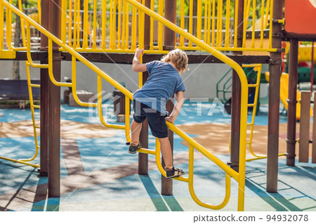 Funny cute happy baby playing on the playground. The emotion of happiness, fun, joy 94932078