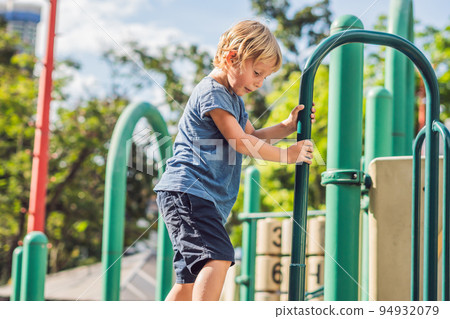 Funny cute happy baby playing on the playground. The emotion of happiness, fun, joy 94932079