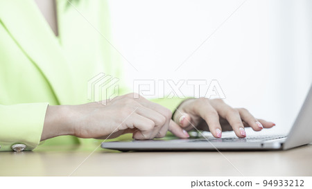 Close up asian business woman using computer laptop, Business asian woman working in office use computer laptop, Business woman working and typing on laptop keyboard in office. Close up asian business woman using computer laptop, Business asian woman working in office use computer laptop, Business woman working and typing on laptop keyboard in office. 94933212