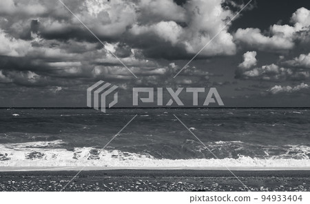 Empty beach view with shore water, monochrome 94933404