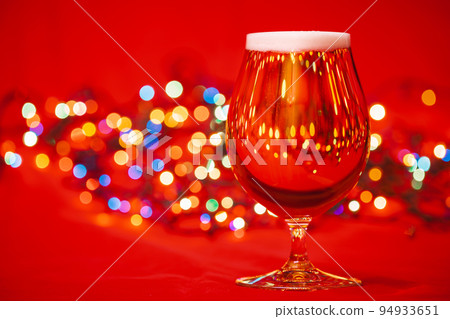 Tulip glass of beer with christmas lights 94933651