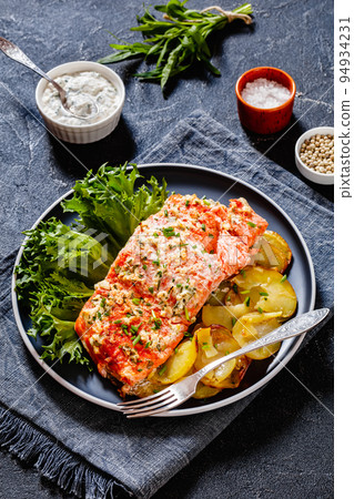salmon with potato and tarragon sour cream sauce salmon with potato and tarragon sour cream sauce 94934231