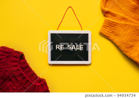 Resale-commerce, re-commerce, re sale concept. Buyback, Trade-In, and Upcycling in Retail. Circular economy. Word resale and clothing on yellow background 94934734