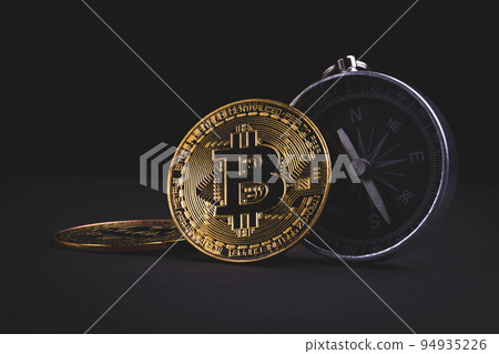 Compass and bitcoin. Travel and cryptocurrencies. Buying tickets with bitcoins. Compass and bitcoin. Travel and cryptocurrencies. Buying tickets with bitcoins. 94935226