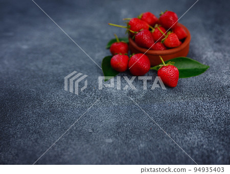Fresh organic strawberries , over dark background 94935403