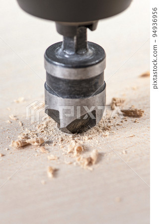 Countersink for deepening the self-tapping screw. A countersink drill makes a recess in a hole for a screw in a wooden board. 94936956