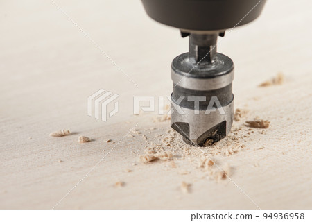 Countersink for deepening the self-tapping screw. A countersink drill makes a recess in a hole for a screw in a wooden board. 94936958