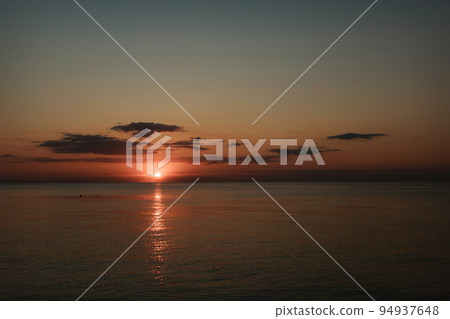 Magic sunset on the sea. Ocean at dawn. Travel to the islands. Postcard for a travel agency 94937648