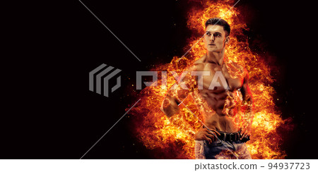 Bodybuilder posing on the fire flames background 94937723