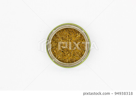 Spices Cumin Zira on a white background. Oriental seasoning for cooking rice and meat pilaf. Aromatic spicy spices for delicious dishes. Dried Whole seeds flowering plant of a fruit Cumin. Isolated Spices Cumin Zira on a white background. Oriental seasoning for cooking rice and meat pilaf. Aromatic spicy spices for delicious dishes. Dried Whole seeds flowering plant of a fruit Cumin. Isolated 94938318