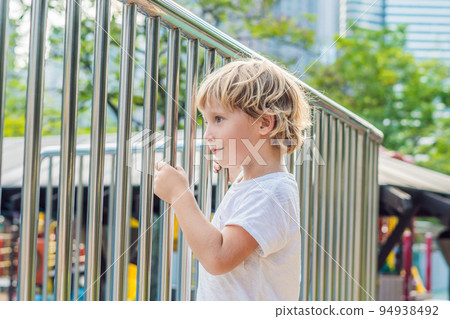 Funny cute happy baby playing on the playground. The emotion of happiness, fun, joy 94938492