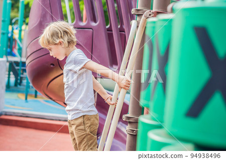 Funny cute happy baby playing on the playground. The emotion of happiness, fun, joy 94938496