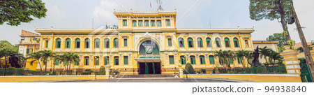 Saigon Central Post Office on blue sky background in Ho Chi Minh, Vietnam. Steel structure of the gothic building was designed by Gustave Eiffel. Inscription in Vietnamese - central post office Saigon Central Post Office on blue sky background in Ho Chi Minh, Vietnam. Steel structure of the gothic building was designed by Gustave Eiffel. Inscription in Vietnamese - central post office 94938840