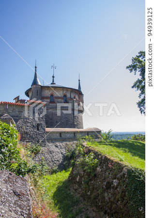 Photo of lichtenstein castle or Schloss on forested rock cliff in Swabian Alps in summer. Seasonal panorama of romantic fairytale palace in Gothic revival style over sky. European famous landmark Photo of lichtenstein castle or Schloss on forested rock cliff in Swabian Alps in summer. Seasonal panorama of romantic fairytale palace in Gothic revival style over sky. European famous landmark 94939125