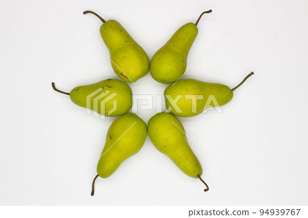 Pears laid out in a circle. Star made from pears on white background. Ripe pears laid out in the shape of an eight-pointed Star. Sweet and juicy pears. Close-up. Top view Pears laid out in a circle. Star made from pears on white background. Ripe pears laid out in the shape of an eight-pointed Star. Sweet and juicy pears. Close-up. Top view 94939767