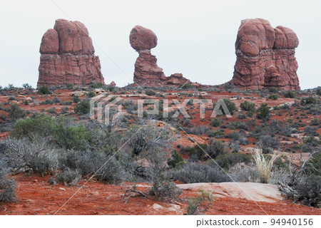 United States Colorado Plateau Arches National Park Balancing Rock and surrounding vegetation in early spring United States Colorado Plateau Arches National Park Balancing Rock and surrounding vegetation in early spring 94940156