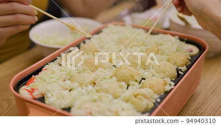 Making takoyaki, Octopus ball at home in the evening 94940310