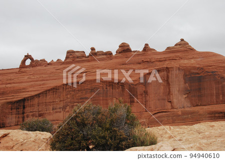 United States Colorado Plateau in early spring Arches National Park Delicate Arch seen from the upper observatory United States Colorado Plateau in early spring Arches National Park Delicate Arch seen from the upper observatory 94940610