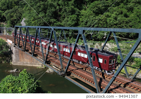 Nose Electric Railway Series 5100 train crossing the Inagawa Bridge Nose Electric Railway Series 5100 train crossing the Inagawa Bridge 94941307