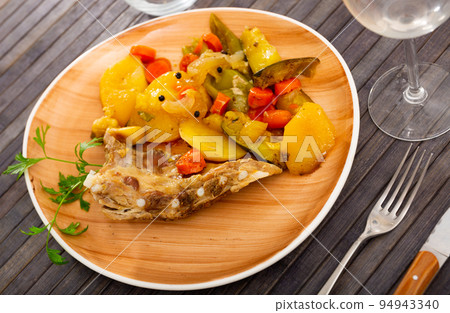 Ribs with vegetables prepared and served on plate Ribs with vegetables prepared and served on plate 94943340