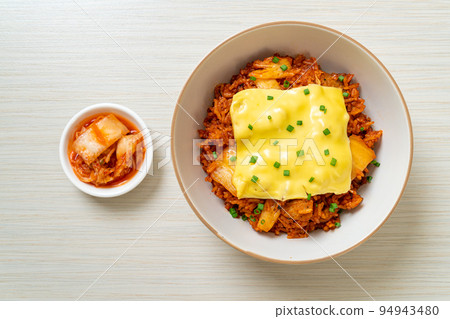 kimchi fried rice with pork and topped cheese 94943480