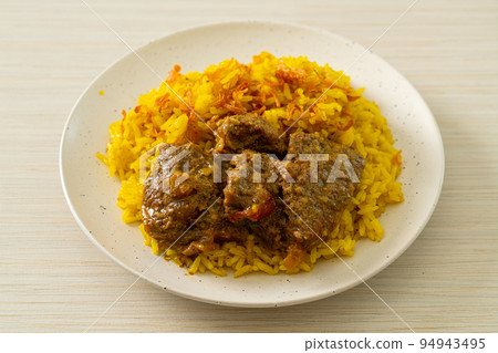 Beef Biryani or Curried rice and beef - Thai-Muslim version of Indian biryani, with fragrant yellow rice and beef 94943495