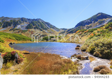Tateyama Kurobe Alpine Route in full bloom in autumn colors Tateyama mountain range from Murododaira Tateyama Kurobe Alpine Route in full bloom in autumn colors Tateyama mountain range from Murododaira 94944283