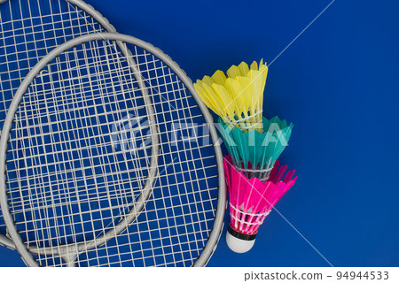 Feathered shuttlecocks and badminton rackets 94944533