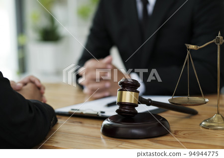 Attorney or lawer consulting client about his offense. 94944775