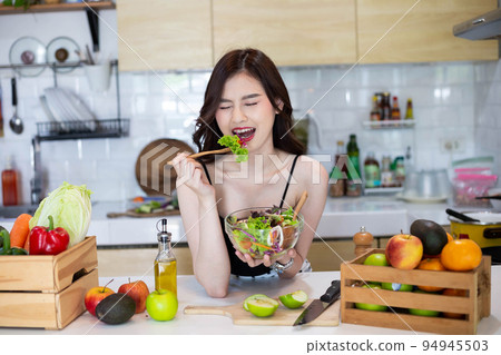 Beautiful Asian Woman smiling preparing vegetable salad in the kitchen Healthy FoodsVegan SaladsVegetarian SaladFood IdeasDiet IdeasHealthy LifestyleCooking At Home Beautiful Asian Woman smiling preparing vegetable salad in the kitchen Healthy FoodsVegan SaladsVegetarian SaladFood IdeasDiet IdeasHealthy LifestyleCooking At Home 94945503