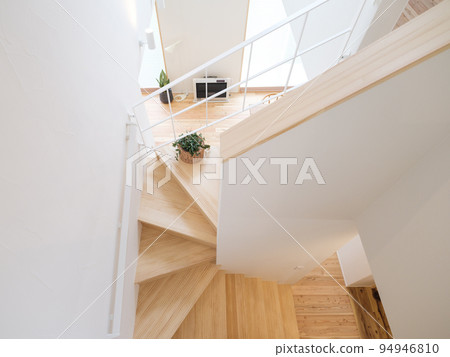 Spiral staircase in a typical wooden house 94946810