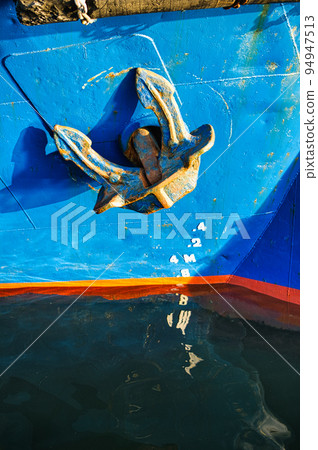 ship anchor moored in harbor 94947513
