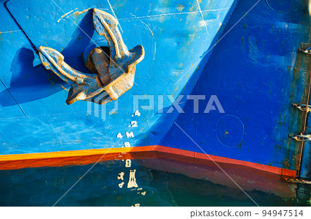 ship anchor moored in harbor 94947514