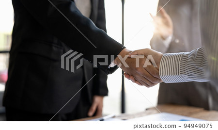 successful negotiate and handshake concept, two businessman shake hand with partner to celebration partnership and teamwork, business deal 94949075