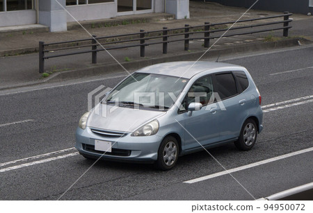 Compact car road driving 94950072